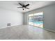 Bedroom with sliding glass doors and pool view at 8015 Idlebriar Ln, Port Richey, FL 34668