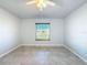 Bright bedroom with ceiling fan and window coverings at 8015 Idlebriar Ln, Port Richey, FL 34668