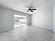 Bedroom with sliding glass doors leading to pool at 8015 Idlebriar Ln, Port Richey, FL 34668