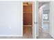 Walk-in closet with wood-like shelving at 8015 Idlebriar Ln, Port Richey, FL 34668