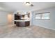 Bright dining area with tile flooring and view into kitchen at 8015 Idlebriar Ln, Port Richey, FL 34668