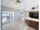 Bright kitchen features a breakfast bar and view of the pool at 8015 Idlebriar Ln, Port Richey, FL 34668