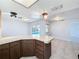 Kitchen with breakfast bar overlooking the pool at 8015 Idlebriar Ln, Port Richey, FL 34668