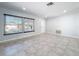 Living room with tile floor and neutral-colored walls at 8015 Idlebriar Ln, Port Richey, FL 34668