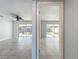Living room with view of pool and sliding glass doors at 8015 Idlebriar Ln, Port Richey, FL 34668