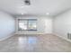 Bright living room featuring tile flooring and a window at 8015 Idlebriar Ln, Port Richey, FL 34668