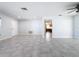 Spacious living room with tile floors and views of kitchen at 8015 Idlebriar Ln, Port Richey, FL 34668