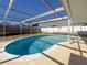 Refreshing kidney-shaped pool, perfect for relaxation at 8015 Idlebriar Ln, Port Richey, FL 34668