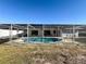 Inviting screened pool with plenty of room for lounging at 8015 Idlebriar Ln, Port Richey, FL 34668