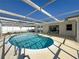 Backyard oasis featuring a kidney-shaped pool at 8015 Idlebriar Ln, Port Richey, FL 34668
