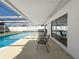 Relaxing pool area with covered patio and seating at 8015 Idlebriar Ln, Port Richey, FL 34668