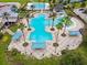 Large community pool with water features and lounge areas at 8144 Sequester Loop, Land O Lakes, FL 34637