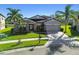 House with a two-car garage and nicely landscaped yard at 8144 Sequester Loop, Land O Lakes, FL 34637