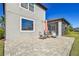 Spacious backyard patio with paver stones and seating area at 8144 Sequester Loop, Land O Lakes, FL 34637