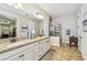 Bathroom with double vanity, large walk-in shower, and tile flooring at 8144 Sequester Loop, Land O Lakes, FL 34637