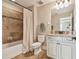 Bathroom with tub/shower combination, granite vanity, and neutral tile at 8144 Sequester Loop, Land O Lakes, FL 34637