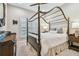 Bedroom with a canopy bed, a dresser, and plenty of natural light at 8144 Sequester Loop, Land O Lakes, FL 34637