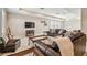 Spacious bonus room with leather sofas and a large TV at 8144 Sequester Loop, Land O Lakes, FL 34637