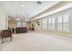 Spacious bonus room with plush carpeting, neutral walls, and abundant natural light at 8144 Sequester Loop, Land O Lakes, FL 34637
