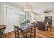 Bright dining area with wooden table and chairs, hardwood floors, and access to backyard at 8144 Sequester Loop, Land O Lakes, FL 34637