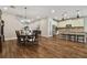 Open dining room with hardwood floors and kitchen view at 8144 Sequester Loop, Land O Lakes, FL 34637