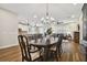 Open concept dining room with hardwood floors and kitchen access at 8144 Sequester Loop, Land O Lakes, FL 34637
