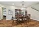 Formal dining room with hardwood floors and adjacent bedroom view at 8144 Sequester Loop, Land O Lakes, FL 34637