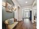 Entryway with hardwood floors, built-in seating, and accent wall at 8144 Sequester Loop, Land O Lakes, FL 34637