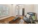Bright entryway with hardwood floors and a charming sitting area at 8144 Sequester Loop, Land O Lakes, FL 34637