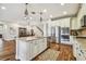 Open concept kitchen with granite countertops and stainless steel appliances at 8144 Sequester Loop, Land O Lakes, FL 34637