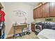 Laundry room with washer, dryer, and built-in cabinets at 8144 Sequester Loop, Land O Lakes, FL 34637
