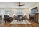 Bright living room with hardwood floors, fireplace, and large windows at 8144 Sequester Loop, Land O Lakes, FL 34637