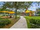 Playground with multiple play areas and shaded seating at 8144 Sequester Loop, Land O Lakes, FL 34637