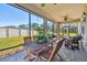 Covered patio with wooden furniture and a ceiling fan at 8144 Sequester Loop, Land O Lakes, FL 34637