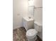 Updated bathroom with white vanity and tiled floor at 9060 Moonlit Meadows Loop, Riverview, FL 33578