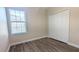 Well-lit bedroom with window and large closet at 9060 Moonlit Meadows Loop, Riverview, FL 33578