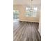 Bright dining room features large window and wood-look floors at 9060 Moonlit Meadows Loop, Riverview, FL 33578