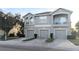 Two-story townhome with three-car garage and balcony at 9060 Moonlit Meadows Loop, Riverview, FL 33578