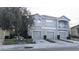 Two-story townhome with three-car garage and balcony at 9060 Moonlit Meadows Loop, Riverview, FL 33578