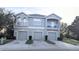 Two-story townhome with three-car garage and balcony at 9060 Moonlit Meadows Loop, Riverview, FL 33578