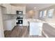 Modern kitchen with stainless steel appliances and white cabinets at 9060 Moonlit Meadows Loop, Riverview, FL 33578