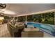 Relaxing pool area with outdoor seating and a built-in kitchen at 1020 Marine St, Clearwater, FL 33755