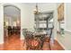 Breakfast nook with glass-top table and seating for four, overlooking the pool at 10714 Tavistock Dr, Tampa, FL 33626