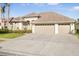 Two-story house with a three-car garage and driveway at 10714 Tavistock Dr, Tampa, FL 33626