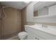 Clean bathroom with tile shower, toilet, and vanity with sink at 1321 Riverside Dr, Tarpon Springs, FL 34689