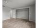 Spacious bedroom with tile floor, double door closet, and neutral walls at 1321 Riverside Dr, Tarpon Springs, FL 34689
