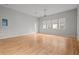 Spacious bedroom with hardwood floors and large windows at 1321 Riverside Dr, Tarpon Springs, FL 34689