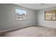 Bright bedroom with wood-look tile floor, large windows, and ceiling fan at 1321 Riverside Dr, Tarpon Springs, FL 34689