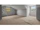 Cozy bedroom with neutral carpet, brick accent wall, and window at 1321 Riverside Dr, Tarpon Springs, FL 34689