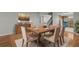 Elegant dining room with hardwood floors and a stylish wooden table at 1321 Riverside Dr, Tarpon Springs, FL 34689